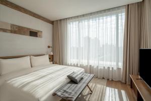 TV a/nebo společenská místnost v ubytování Sahe Hotel Shanghai World Expo