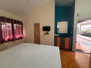 Postel nebo postele na pokoji v ubytování Hotel Sai Plaza