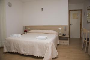 Postel nebo postele na pokoji v ubytování Hotel Cima Tosa