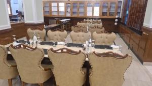 a dining room with a table and chairs at Mentokling Residency, Leh, Ladakh in Leh