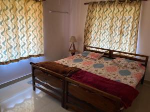 Postel nebo postele na pokoji v ubytování Bee Hive Homestay