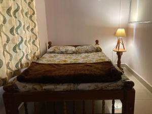 Postel nebo postele na pokoji v ubytování Bee Hive Homestay + 3 fotografie
