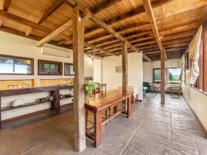 a dining room with a wooden table in a room at Abington Farm in Heyfield