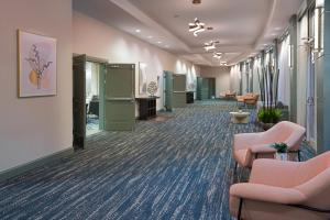 an office lobby with chairs and a waiting room at DoubleTree by Hilton Houston Westchase in Houston