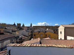 a view of a city with roofs and buildings at Argenteria5 Holiday Rooms in Palermo