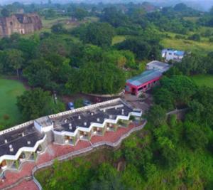 an aerial view of a train station on a hill at Rupmati The Valley Hotel in Māndu