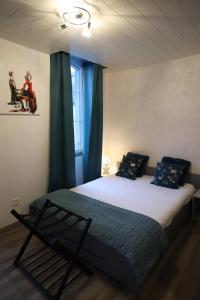 L'Atelier 57 - Votre meublé authentique !客房内的一张或多张床位