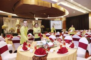 a group of people in a banquet hall with tables at Atria Hotel Malang in Malang +29 photos