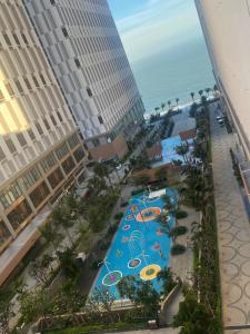 an aerial view of a pool at a resort at Apec Mandala Mui Ne Beach Studio in Ấp Thiẹn Ái