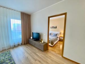 Postel nebo postele na pokoji v ubytování Cozy Foorum Apartment - Tallinn City Centre