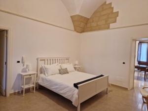 Säng eller sängar i ett rum på Al centro di Lecce appartamento Le Due Rose