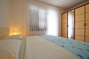 Posteľ alebo postele v izbe v ubytovaní Hella Apartments