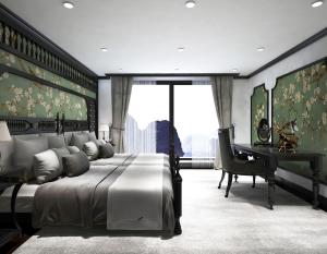 a bedroom with a large bed and a desk at Era Cruises Halong in Ha Long