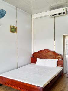 Postel nebo postele na pokoji v ubytování Homestay Nguyễn Hùng