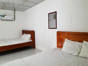 Postel nebo postele na pokoji v ubytování Homestay Nguyễn Hùng