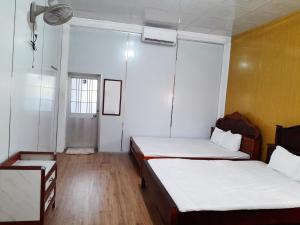Postel nebo postele na pokoji v ubytování Homestay Nguyễn Hùng