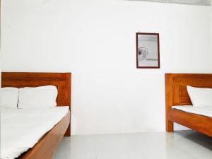 Postel nebo postele na pokoji v ubytování Homestay Nguyễn Hùng