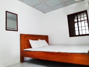Postel nebo postele na pokoji v ubytování Homestay Nguyễn Hùng