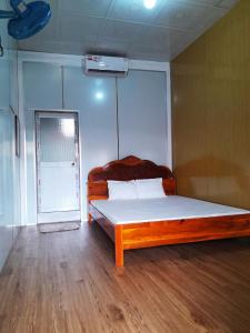 Postel nebo postele na pokoji v ubytování Homestay Nguyễn Hùng