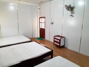 Postel nebo postele na pokoji v ubytování Homestay Nguyễn Hùng