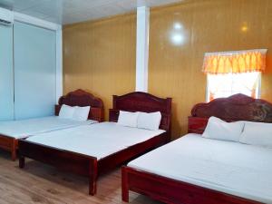 Postel nebo postele na pokoji v ubytování Homestay Nguyễn Hùng