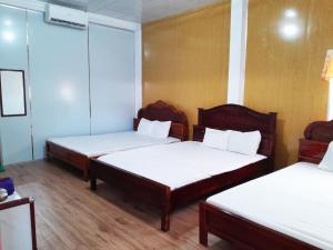 Postel nebo postele na pokoji v ubytování Homestay Nguyễn Hùng