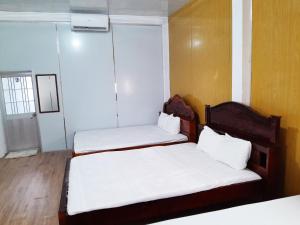 Postel nebo postele na pokoji v ubytování Homestay Nguyễn Hùng
