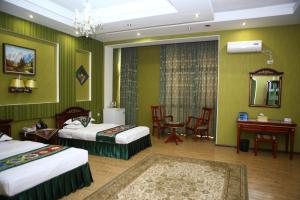 Postel nebo postele na pokoji v ubytování ORIYO DUSHANBE HOTEL