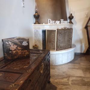 a room with a fireplace with a sign that reads death at Maribel Guesthouse in Mína