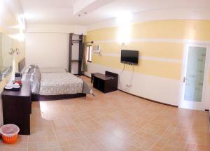 Postel nebo postele na pokoji v ubytování Metro Park Hotel Mandaue