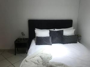 En eller flere senge i et værelse på Appartement à la découverte de Strasbourg