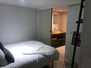 En eller flere senge i et værelse på Appartement à la découverte de Strasbourg