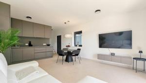 TV a/nebo společenská místnost v ubytování Casa Lavanda