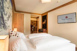Posteľ alebo postele v izbe v ubytovaní Hotel Eden Rock