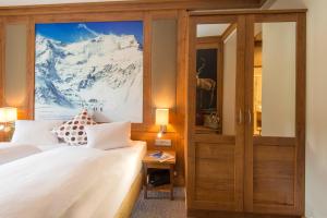 Posteľ alebo postele v izbe v ubytovaní Hotel Eden Rock