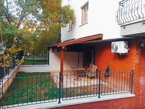 a house with a fence in front of it at BUTİK 24 SUİTES in Ankara