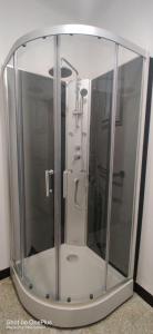 a shower in a glass enclosure in a bathroom at Maison de village, au calme. in Camps-la-Source +25 photos