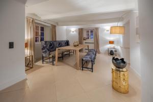 a dining room with a table and chairs at Beau Clocher in Saint-Tropez