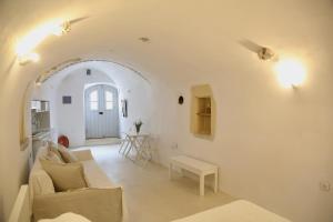 a living room with a couch and a table at Axion Studios in Aroniadika