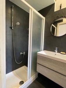 a bathroom with a shower and a sink at Apartment Navigli Milano in Milan