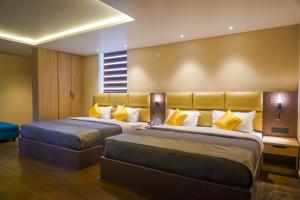 Ένα ή περισσότερα κρεβάτια σε δωμάτιο στο Trident