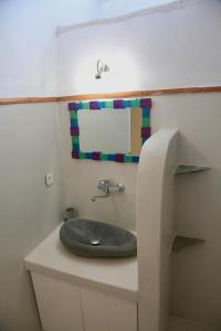 a bathroom with a sink on top of a counter at Axion Studios in Aroniadika
