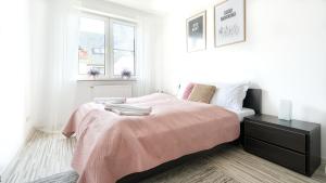 Ένα ή περισσότερα κρεβάτια σε δωμάτιο στο Plac Neptuna, Sun & Snow