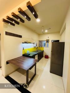 a kitchen with a wooden table in a room at 3BHK - Entire property - New listing at OFFER PRICE in Aurangabad