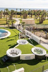 an aerial view of a resort with a water park at Casa Bravo Ivan Luxury Homes 1ªPta Sur 1ªLínea in Castellón de la Plana