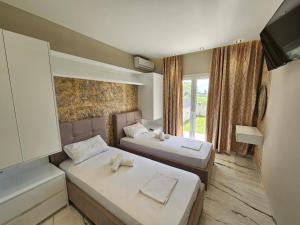 Postel nebo postele na pokoji v ubytování Evelina Luxury Suites in Corfu