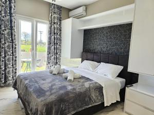 Postel nebo postele na pokoji v ubytování Evelina Luxury Suites in Corfu