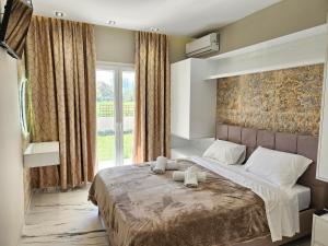 Postel nebo postele na pokoji v ubytování Evelina Luxury Suites in Corfu