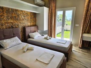 Postel nebo postele na pokoji v ubytování Evelina Luxury Suites in Corfu