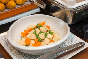 a bowl of vegetables sitting on a table at HOTEL GLOBAL VIEW Morioka in Morioka +84 photos